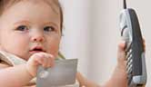 Baby with credit card and phone